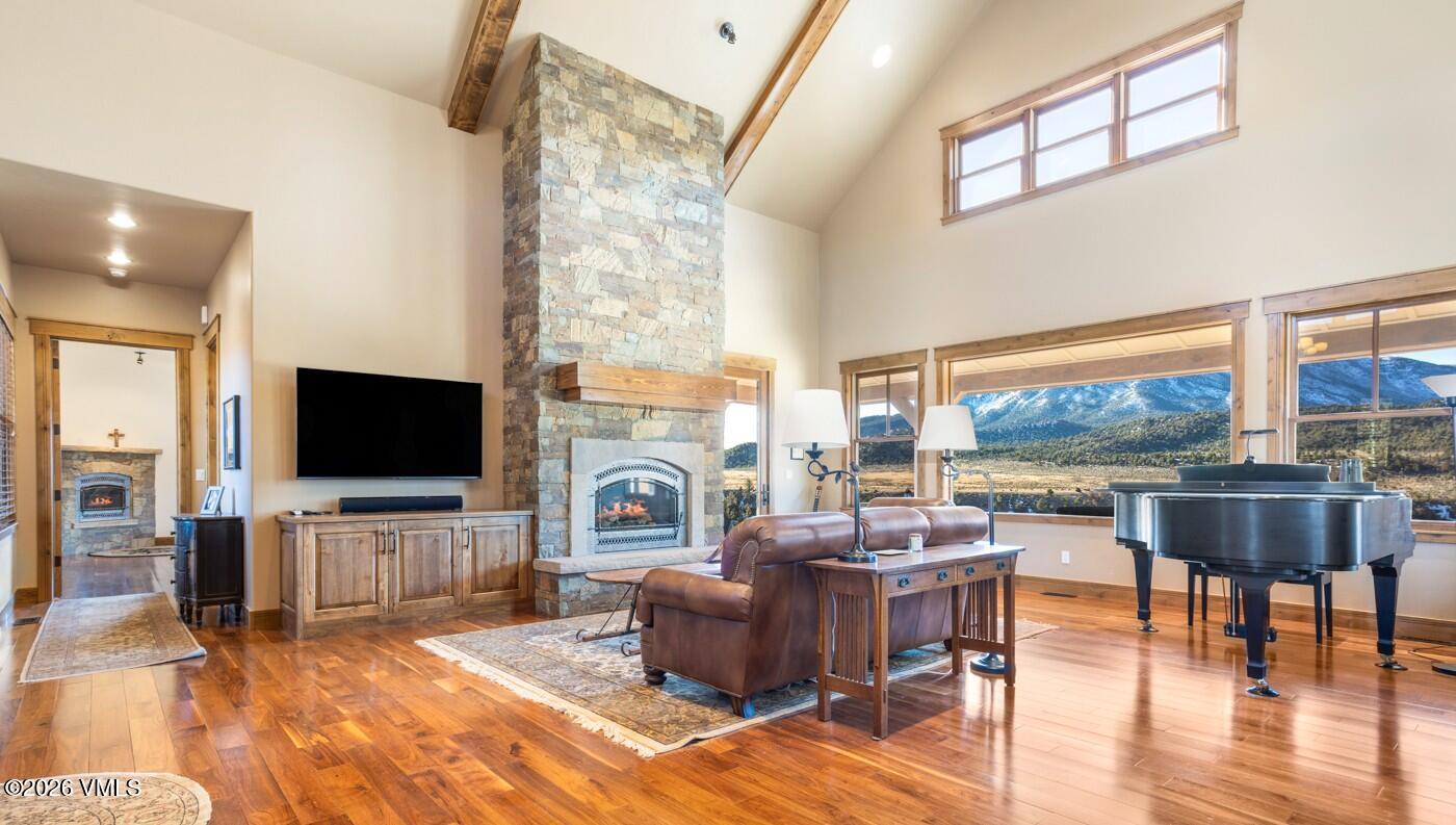 34900 Colorado River Road McCoy, CO 80463 - Photo 13 of 46 a living room with fireplace furniture and a flat screen tv