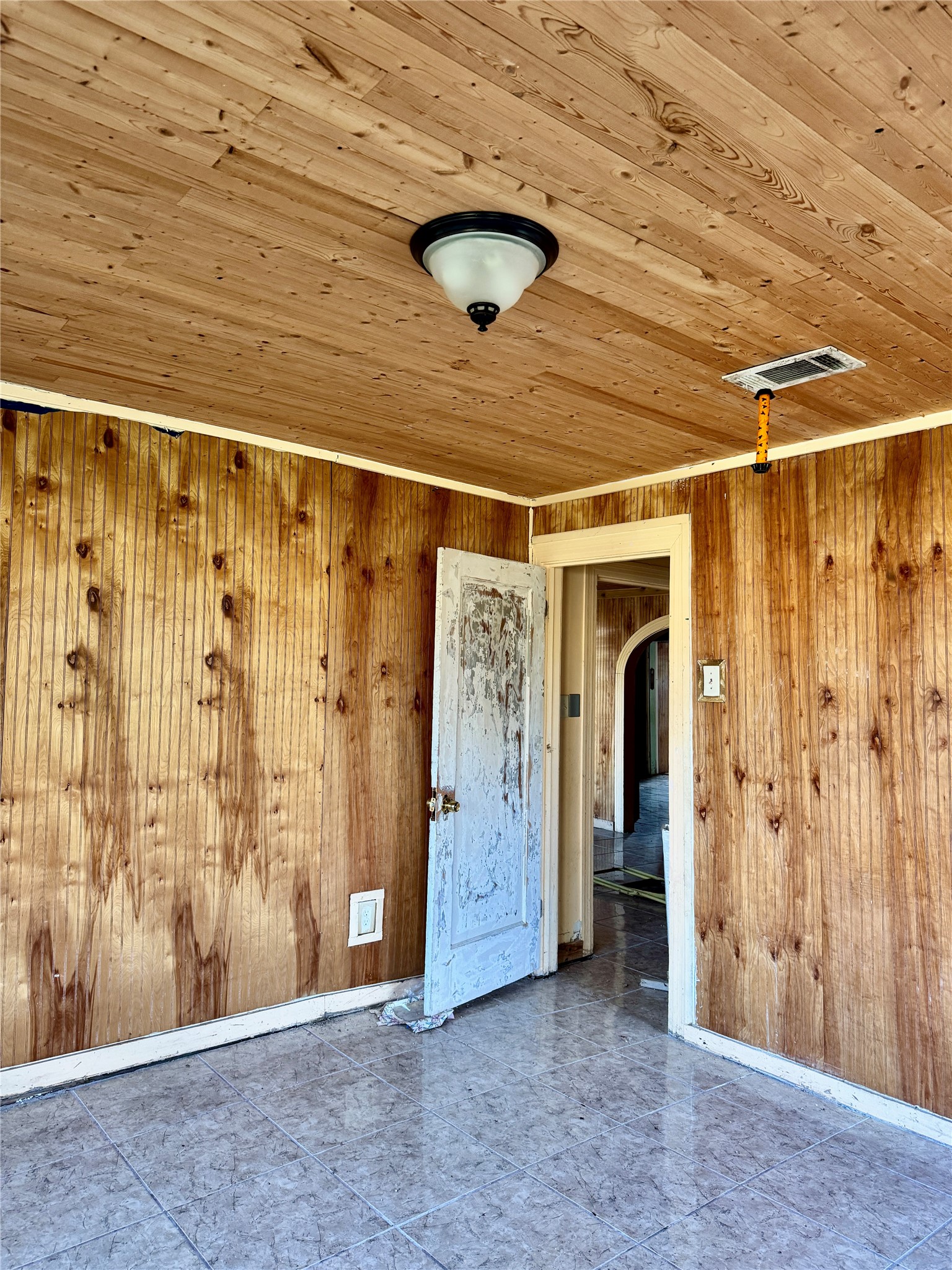 2340 19th Street Port Arthur, TX 77640 - Photo 11 of 13 a view of a hallway with wooden walls