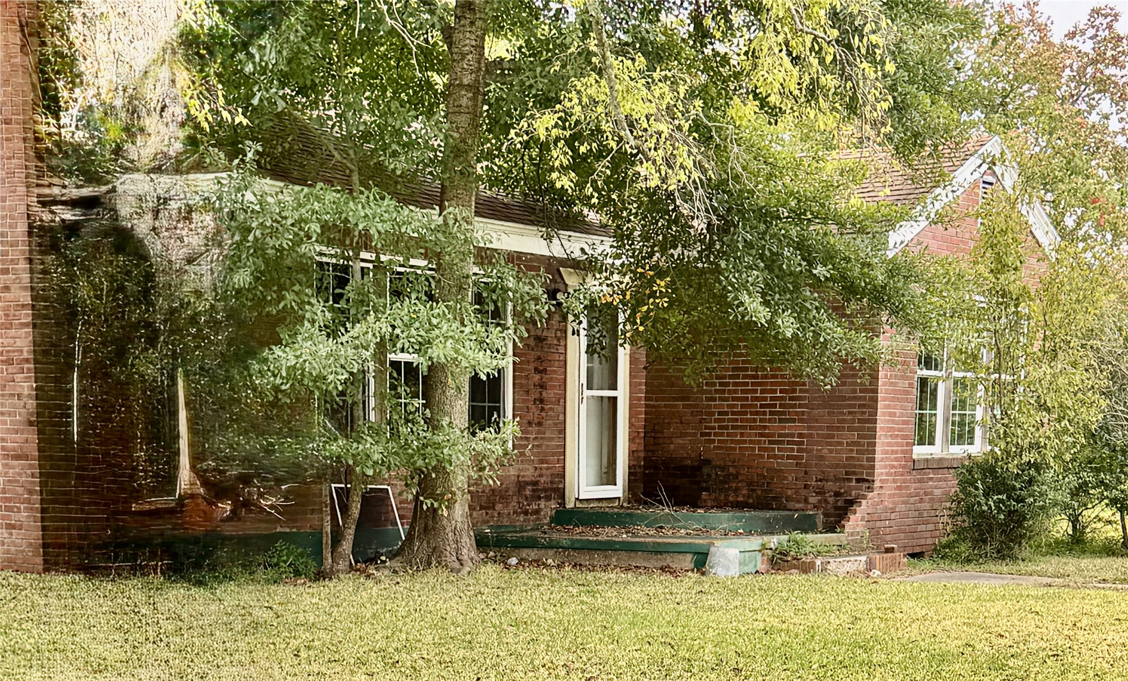 2340 19th Street Port Arthur, TX 77640 - Photo 2 of 13 a front view of a house with garden