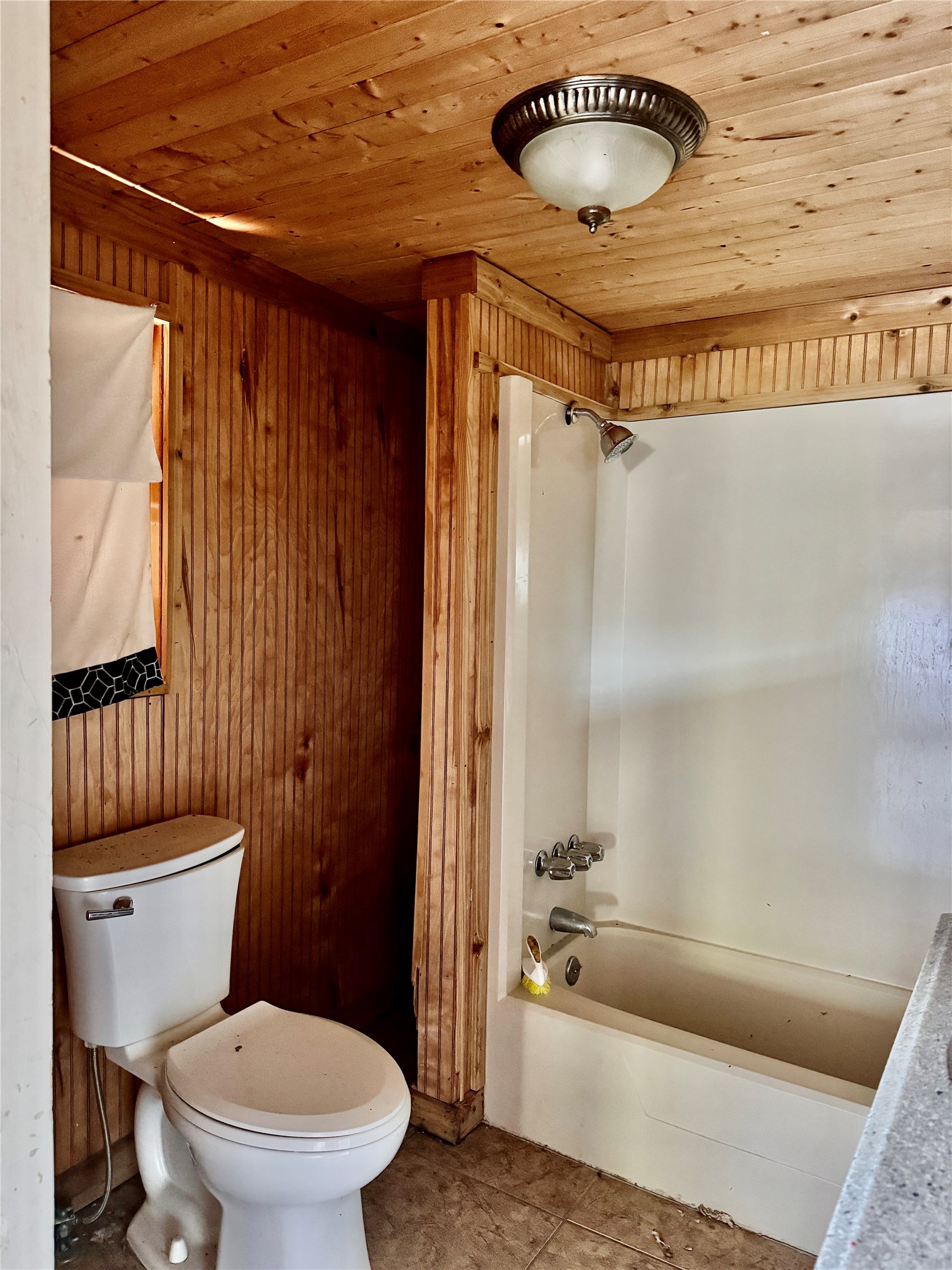 2340 19th Street Port Arthur, TX 77640 - Photo 5 of 13 a bathroom with a toilet and a tub