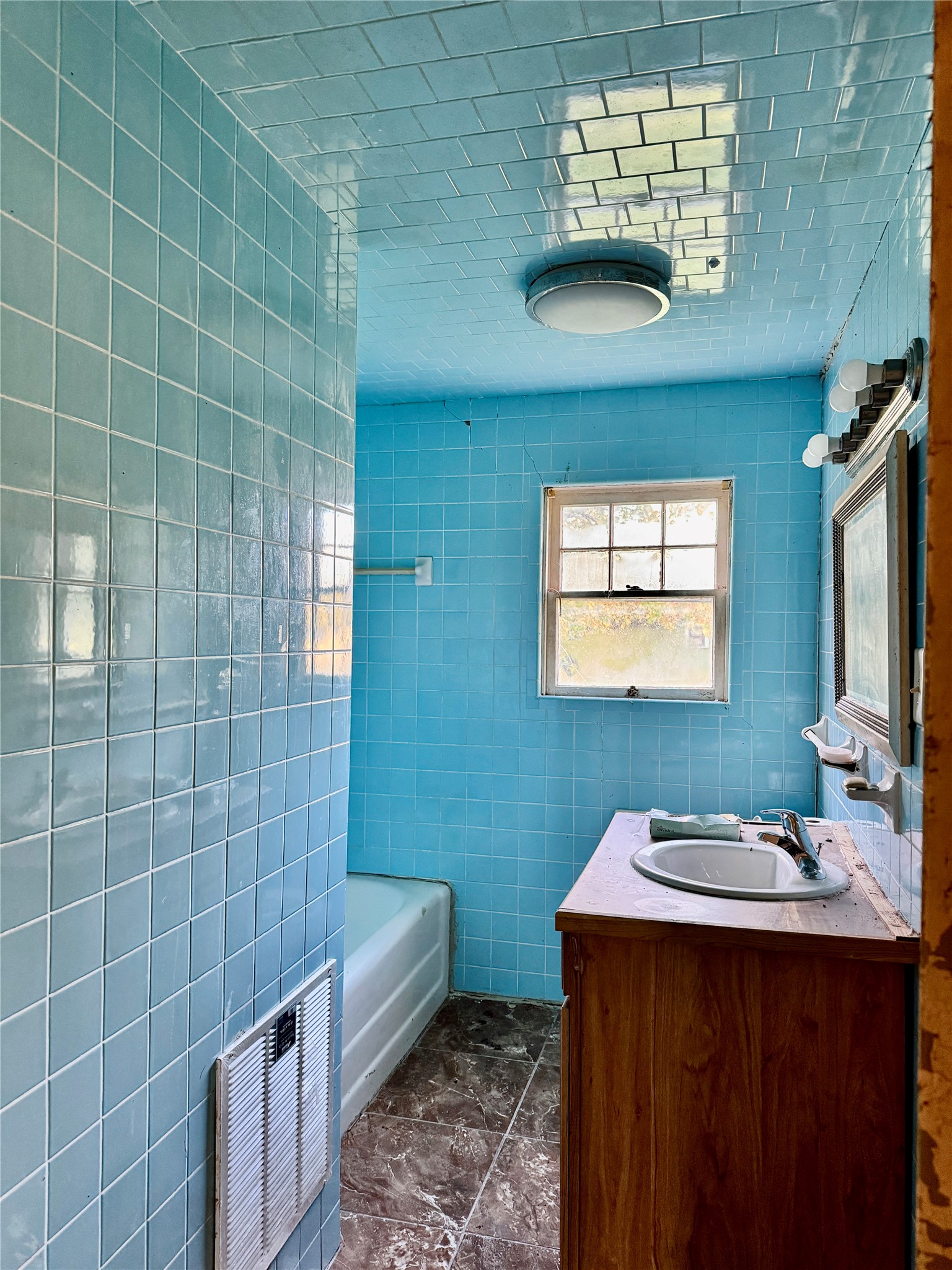 2340 19th Street Port Arthur, TX 77640 - Photo 9 of 13 a bathroom with a sink a toilet and a mirror