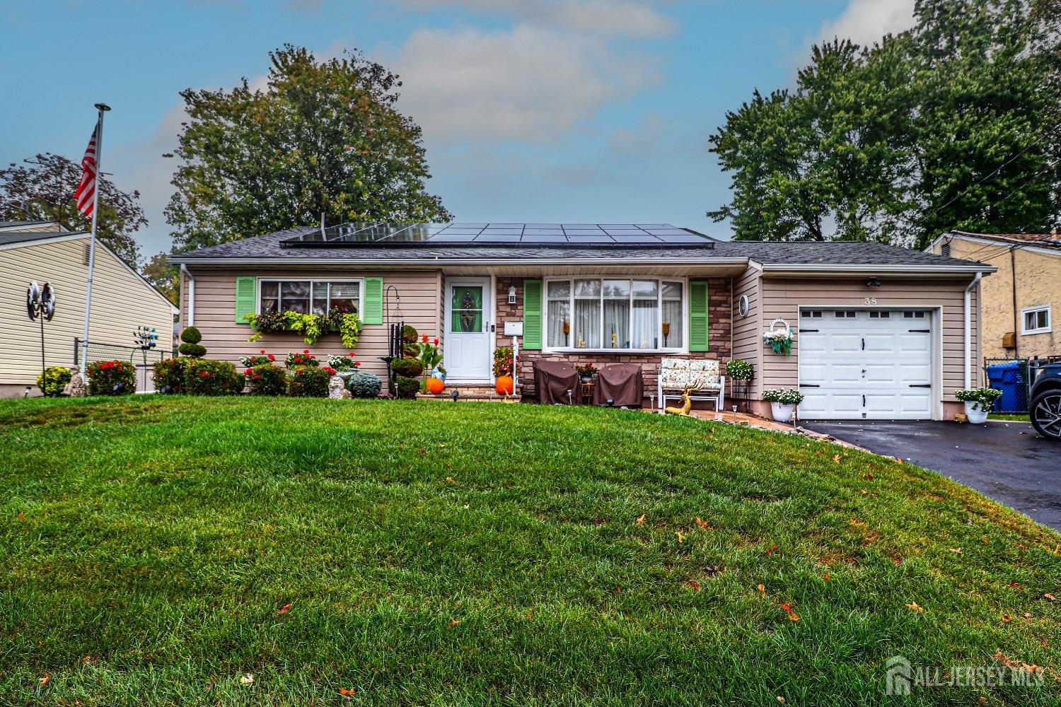 38 Westminster Road Colonia, NJ 07067 - Photo 1 of 24 a front view of house with yard and outdoor seating