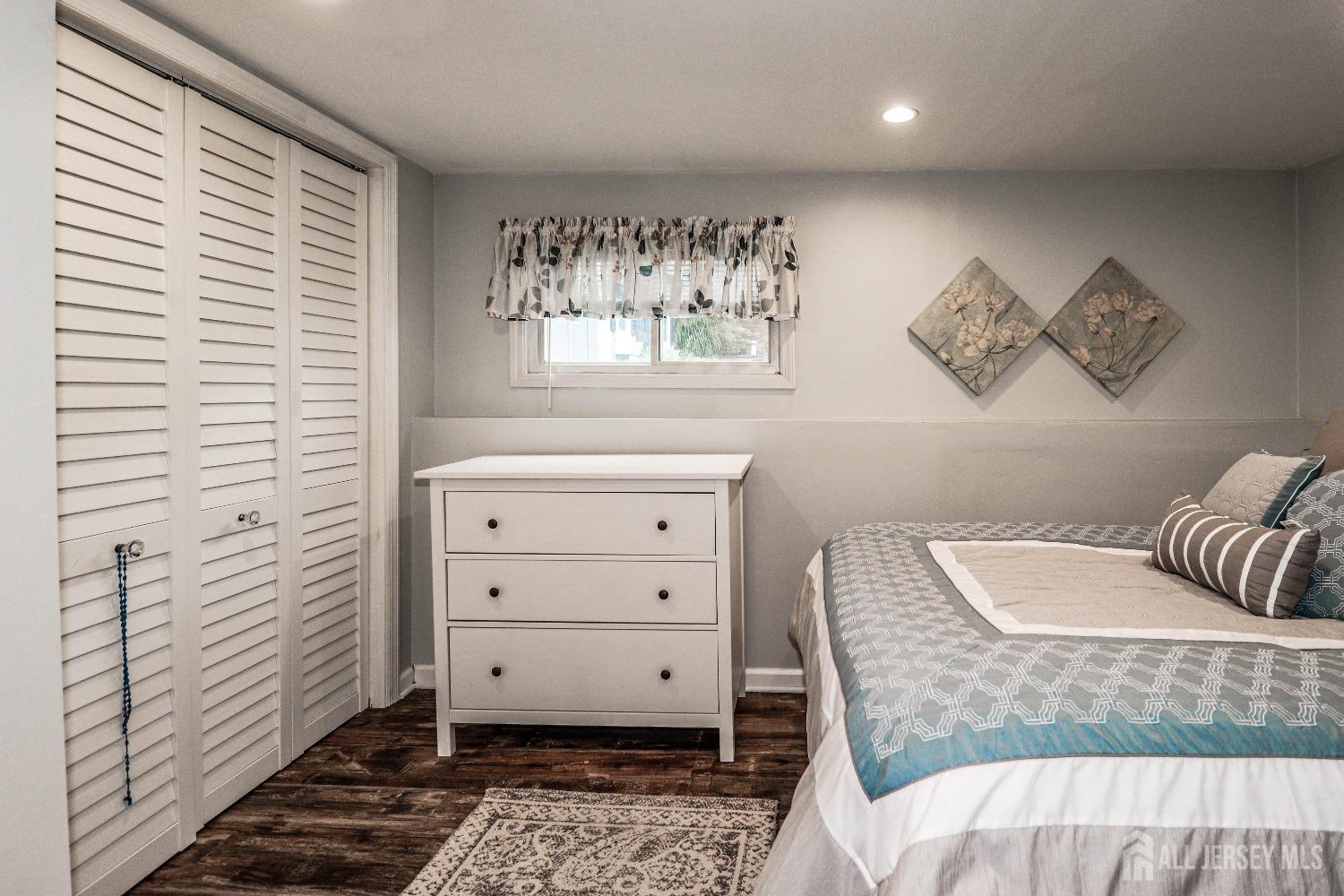 38 Westminster Road Colonia, NJ 07067 - Photo 13 of 24 a view of a bedroom with furniture and window