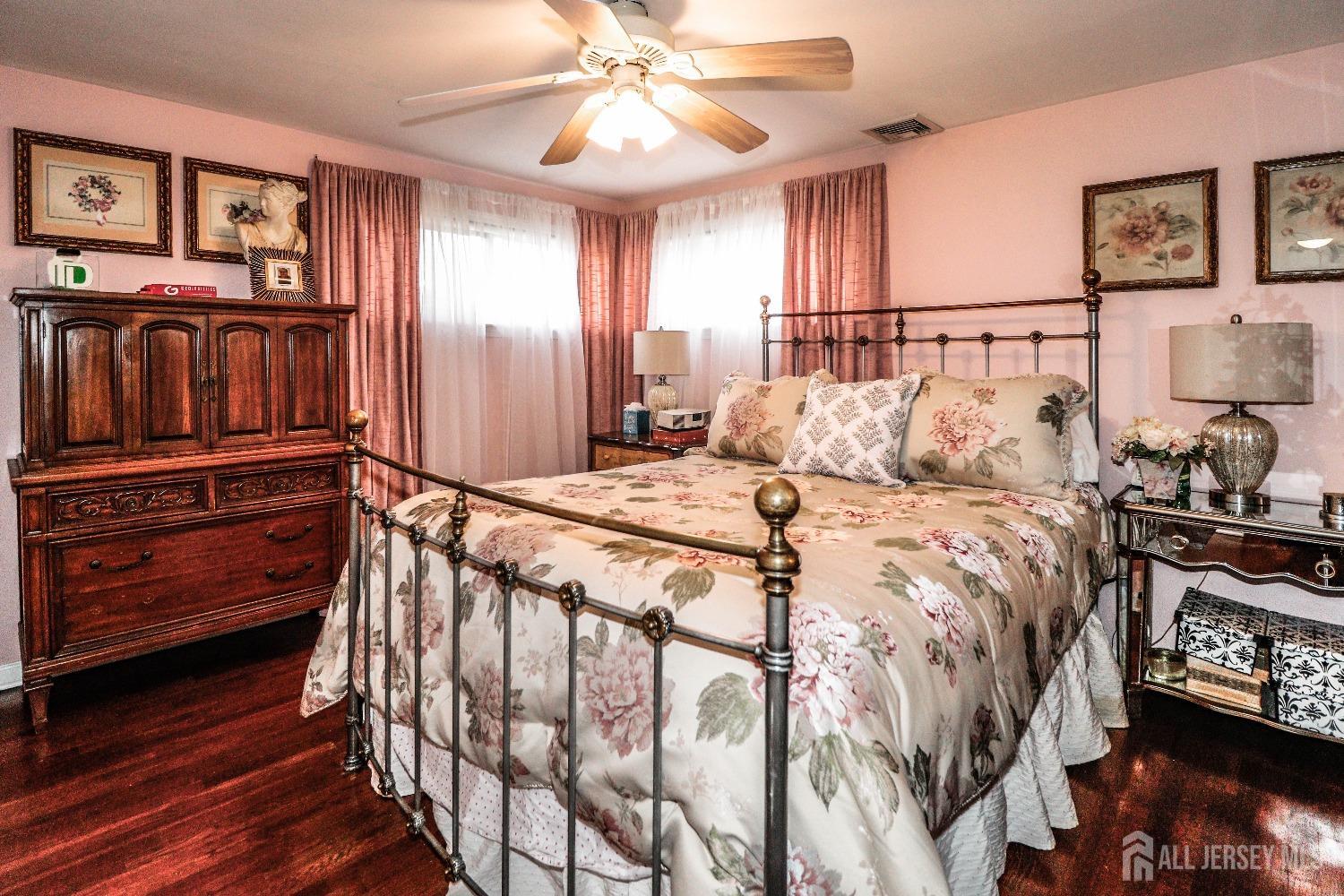 38 Westminster Road Colonia, NJ 07067 - Photo 18 of 24 a bedroom with a bed and a chandelier
