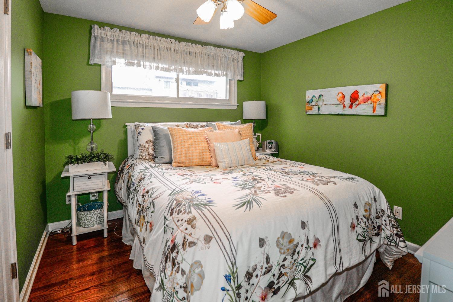 38 Westminster Road Colonia, NJ 07067 - Photo 19 of 24 a bedroom with a bed and a chandelier