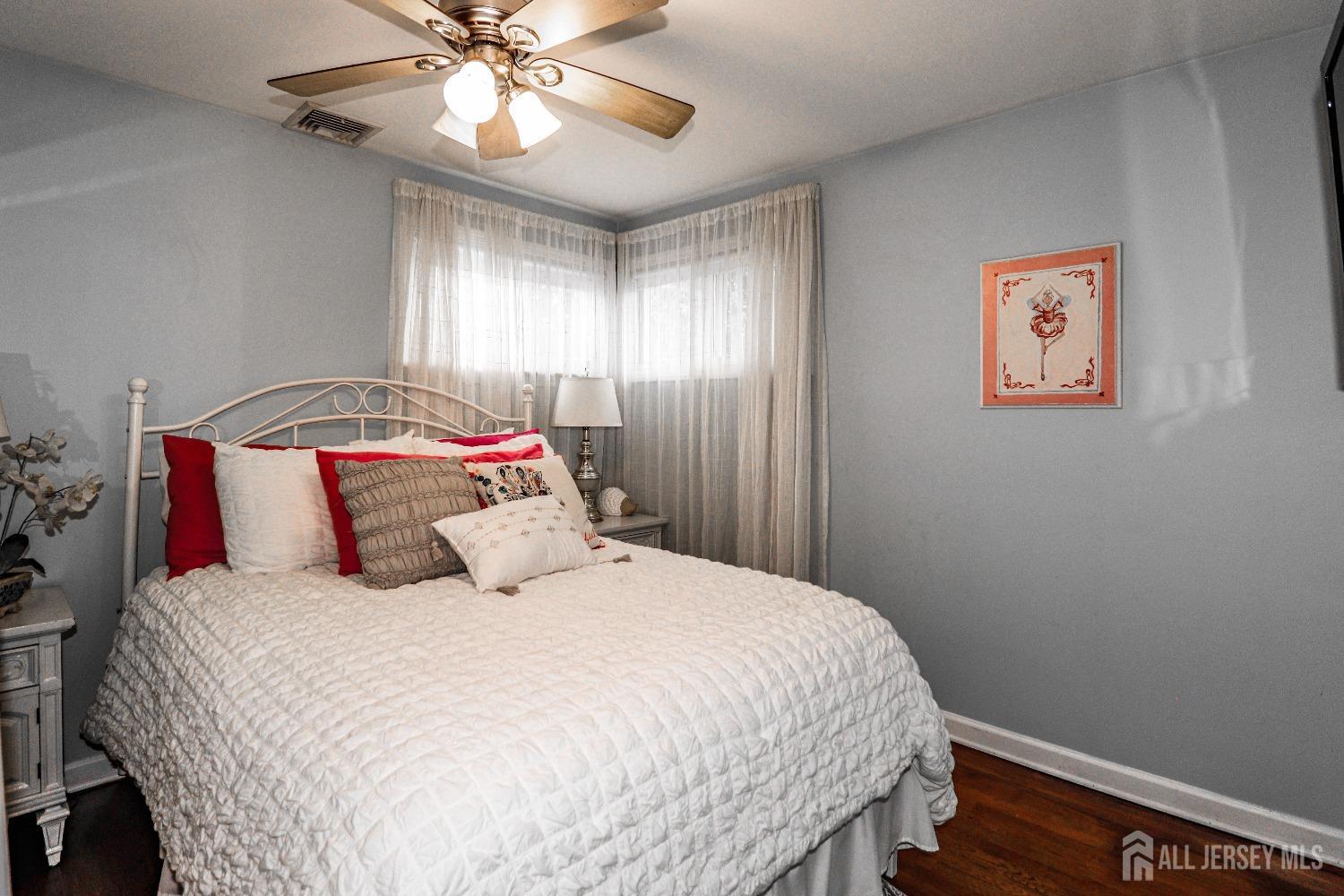 38 Westminster Road Colonia, NJ 07067 - Photo 20 of 24 a bedroom with a bed and a chandelier