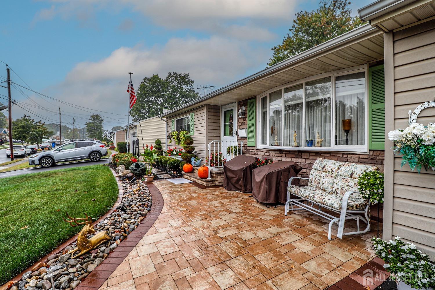 38 Westminster Road Colonia, NJ 07067 - Photo 2 of 24 a view of a house with backyard sitting area and garden