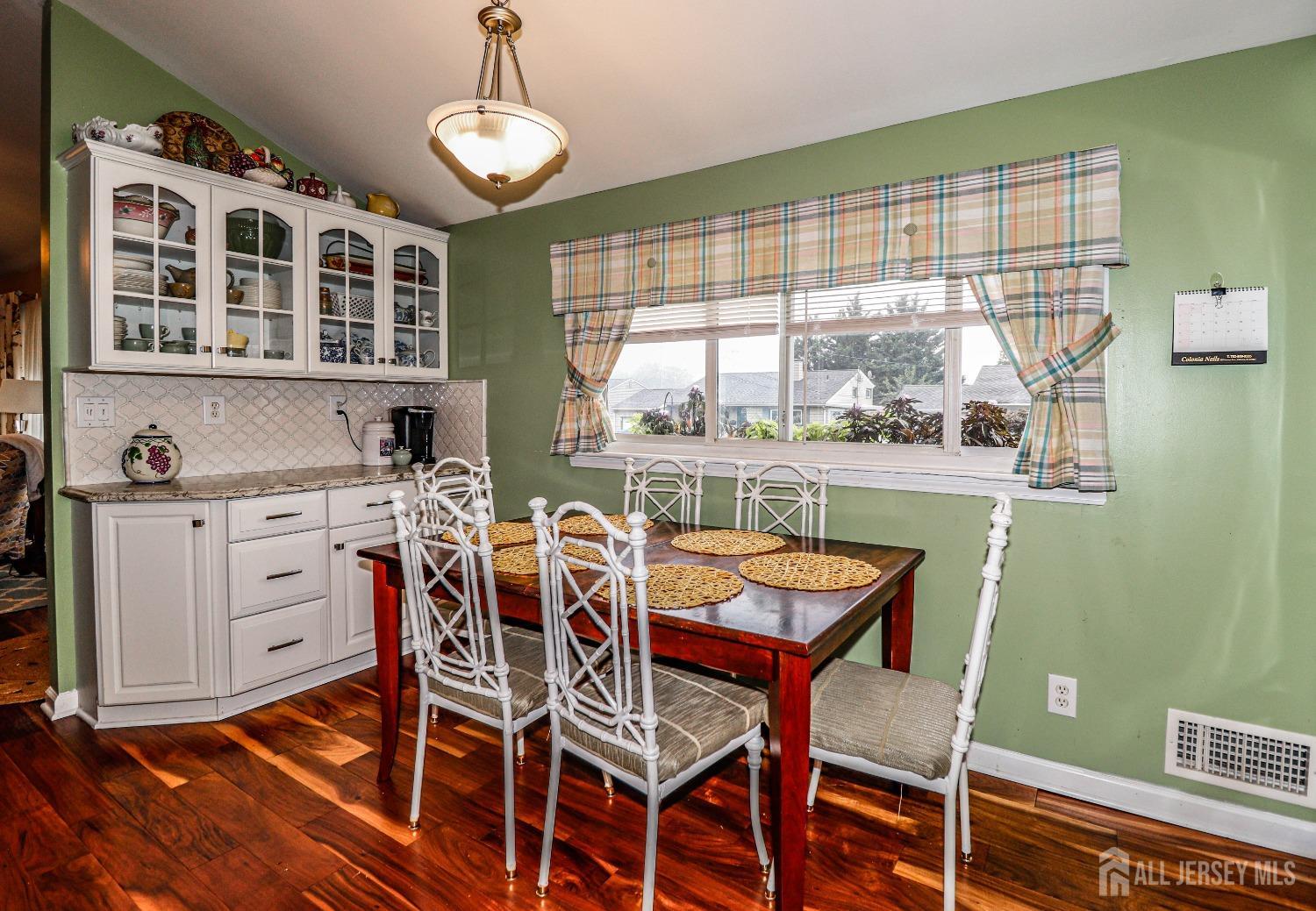 38 Westminster Road Colonia, NJ 07067 - Photo 9 of 24 a dining room with furniture a chandelier and window