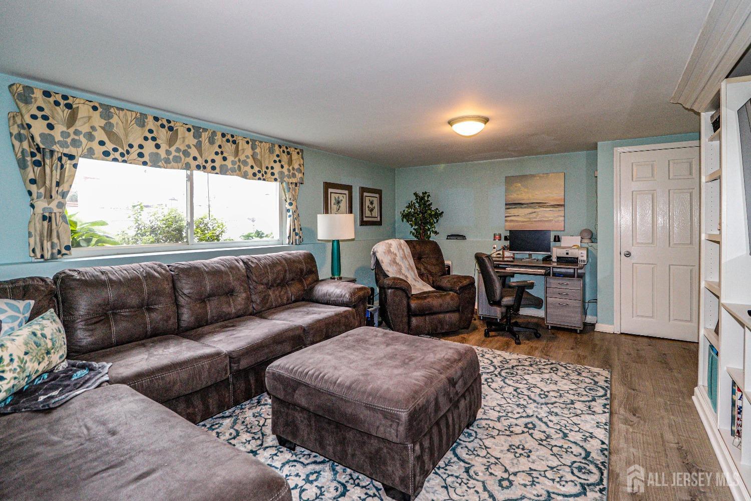 38 Westminster Road Colonia, NJ 07067 - Photo 10 of 24 a living room with furniture and a large window