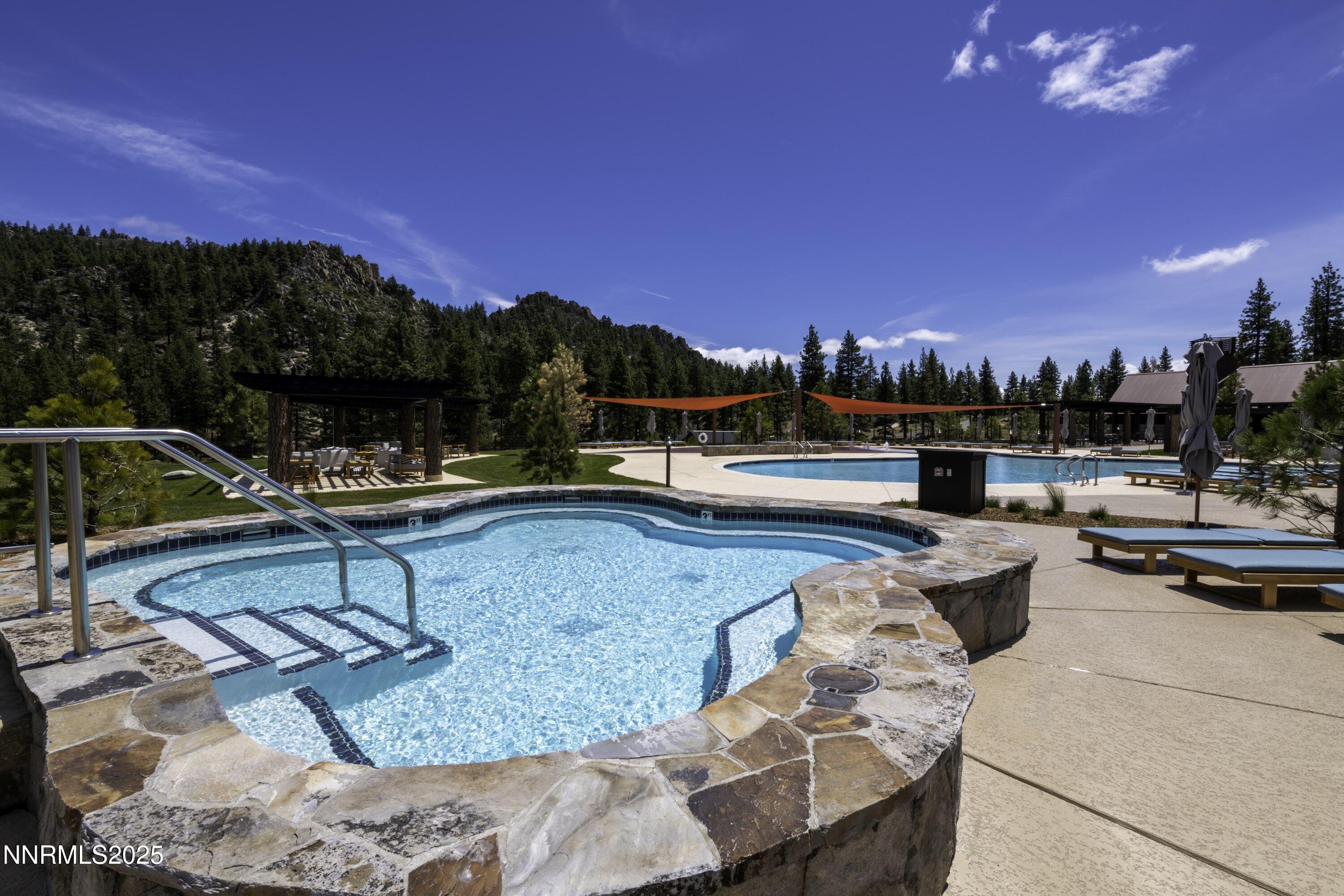 245 Redding Way, Unit 226 Carson City, NV 89705 - Photo 28 of 40 a view of a swimming pool with lounge chairs