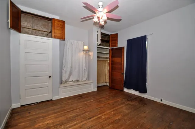a view of an empty room with a fireplace