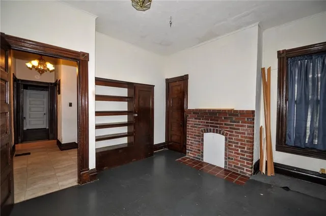 a view of an empty room with a window