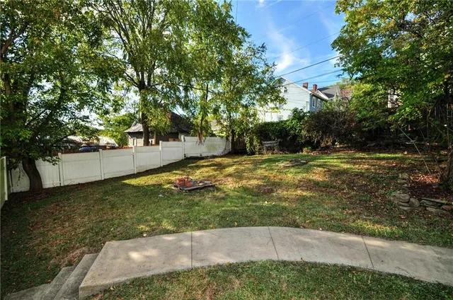 a backyard of a house with lots of green space