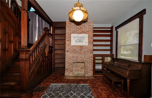a view of entryway with wooden door