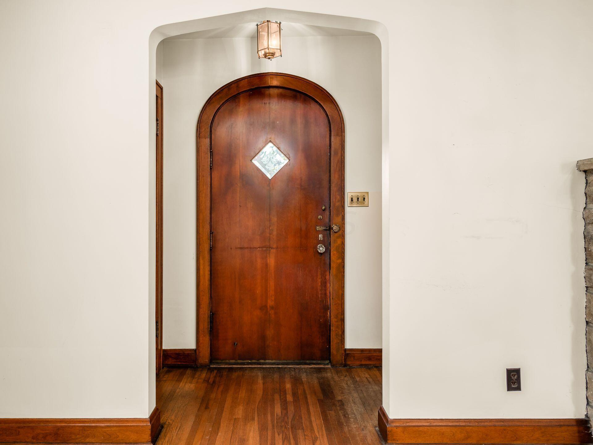 1974 Chatfield Road Columbus, OH 43221 - Photo 5 of 48 Original wood front door and Tudor arches throughout