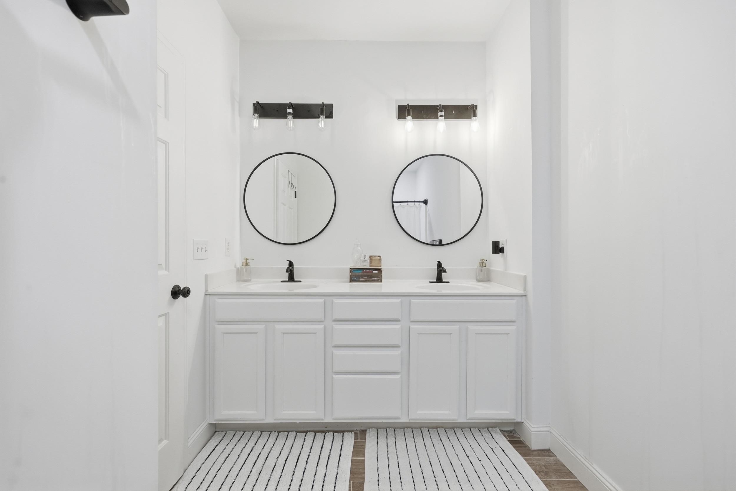 5810 Longwood Drive, Unit 303 Murrells Inlet, SC 29576 - Photo 15 of 27 Full bath featuring double vanity and baseboards