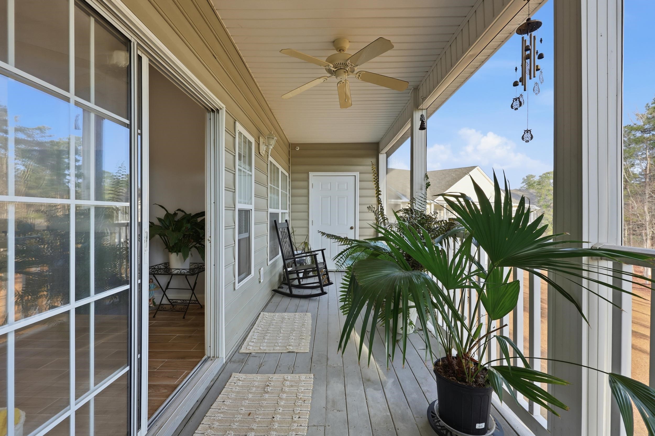 5810 Longwood Drive, Unit 303 Murrells Inlet, SC 29576 - Photo 16 of 27 Balcony with a ceiling fan