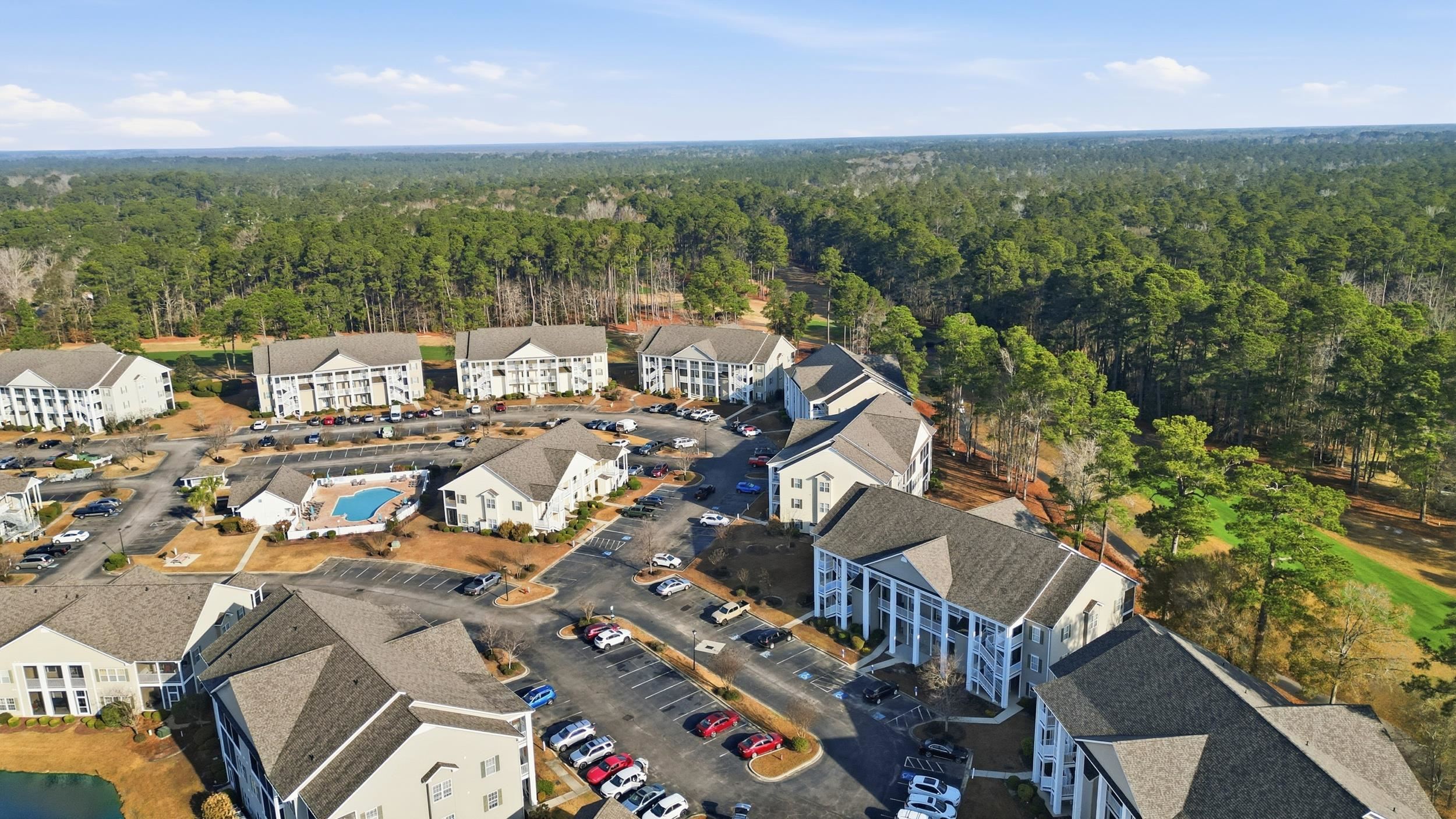 5810 Longwood Drive, Unit 303 Murrells Inlet, SC 29576 - Photo 20 of 27 Aerial view of a heavily wooded area