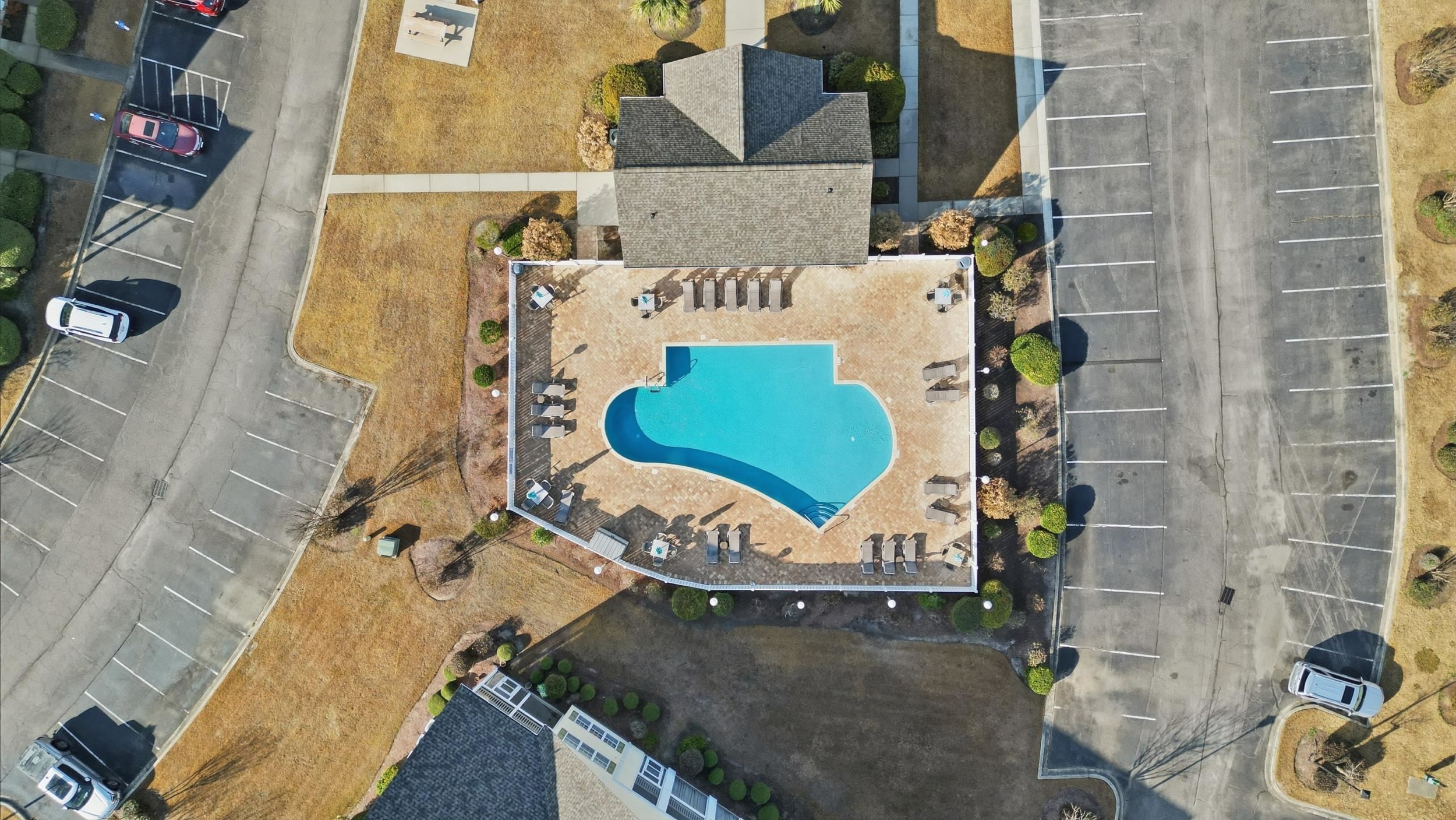 5810 Longwood Drive, Unit 303 Murrells Inlet, SC 29576 - Photo 22 of 27 Aerial view of a pool