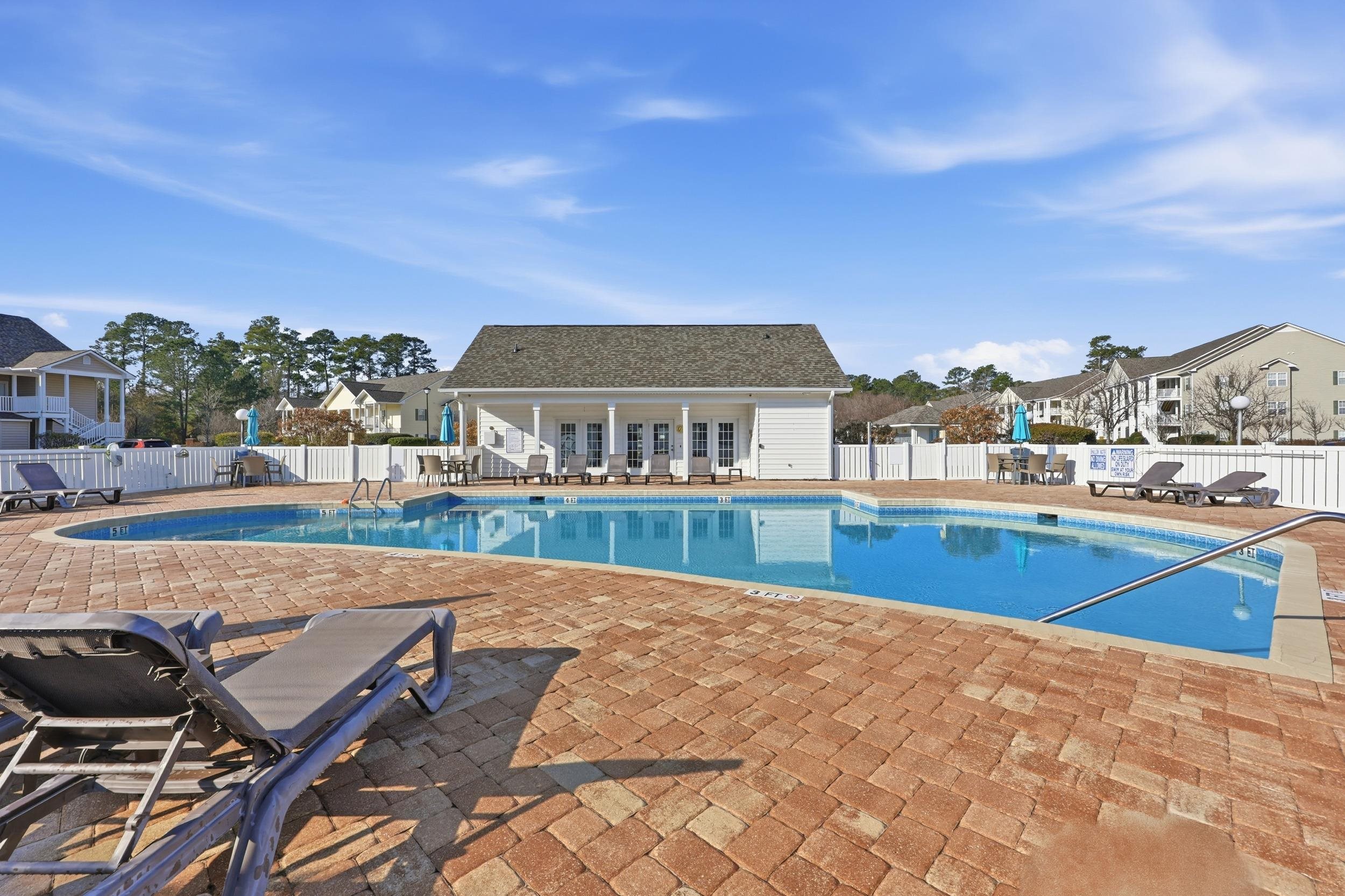 5810 Longwood Drive, Unit 303 Murrells Inlet, SC 29576 - Photo 23 of 27 Community pool featuring a patio and an outdoor structure