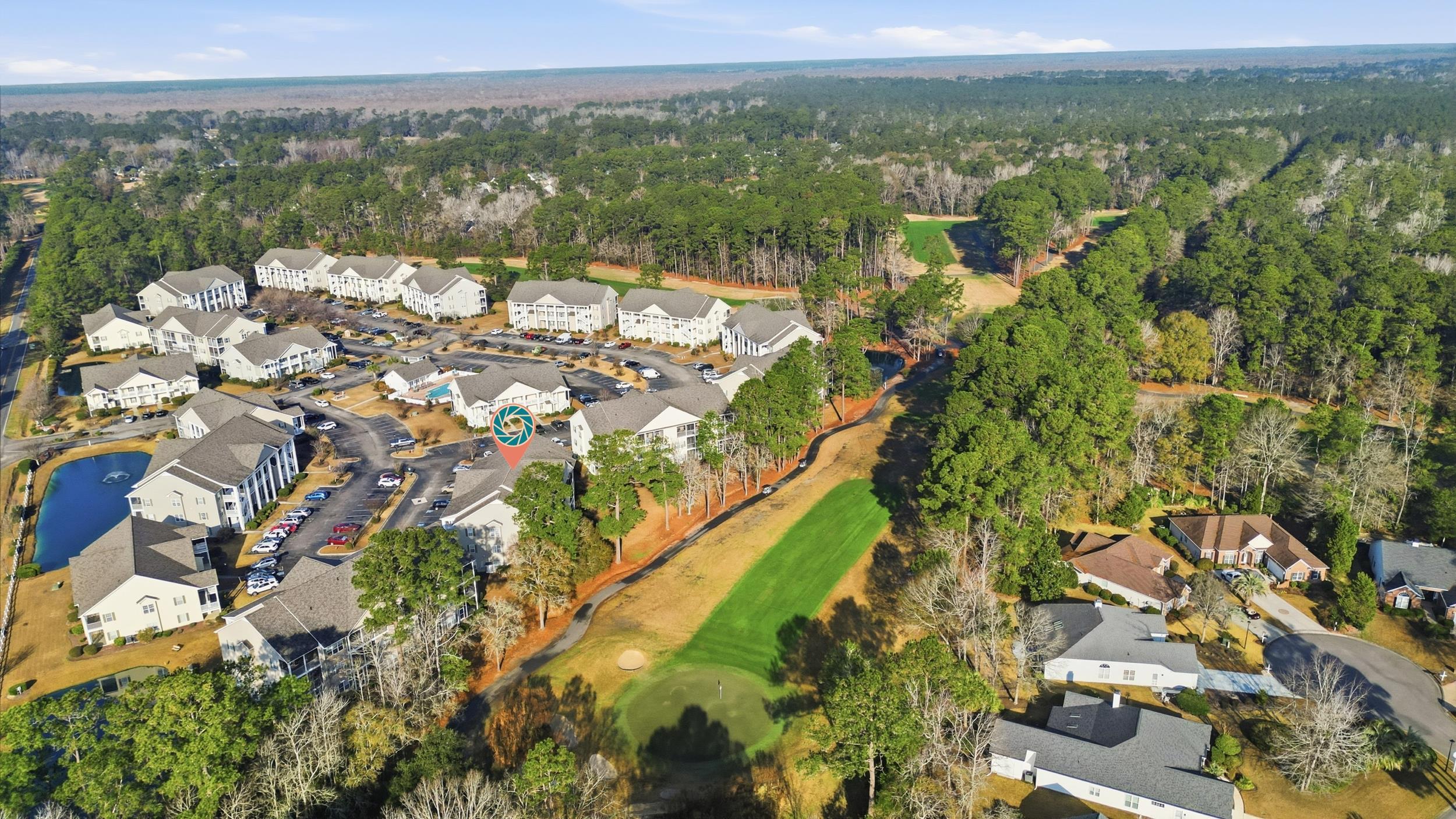 5810 Longwood Drive, Unit 303 Murrells Inlet, SC 29576 - Photo 25 of 27 Aerial view of property's location featuring nearby suburban area and a golf club