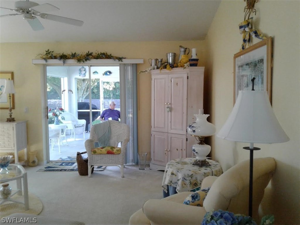 210 Roat Street Lehigh Acres, FL 33936 - Photo 7 of 9 a living room with furniture and a window