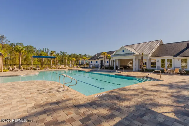 a view of house with outdoor space and seating area