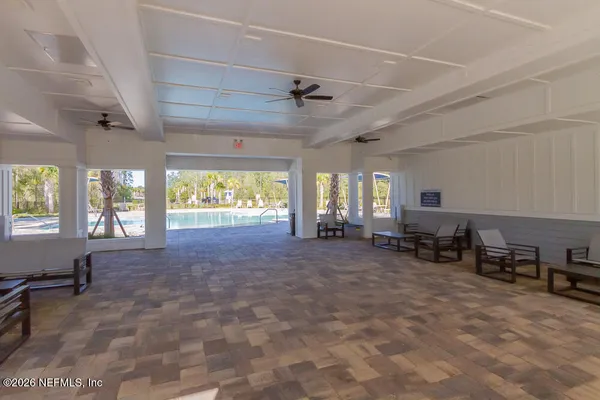 a room with furniture and a large window