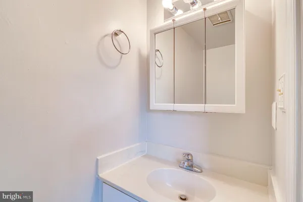 a bathroom with a sink and vanity