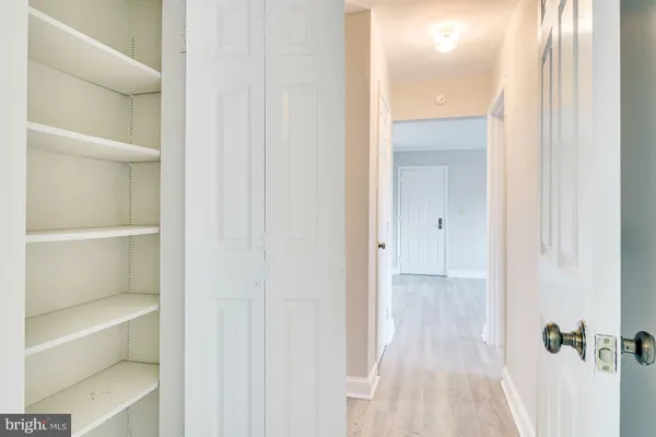 a view of a hallway with closet