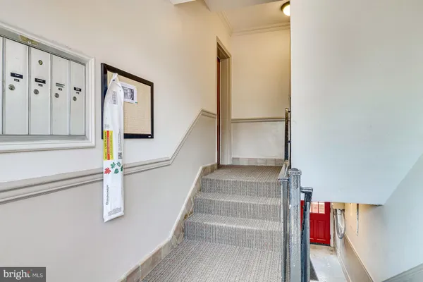 a view of staircase with white walls