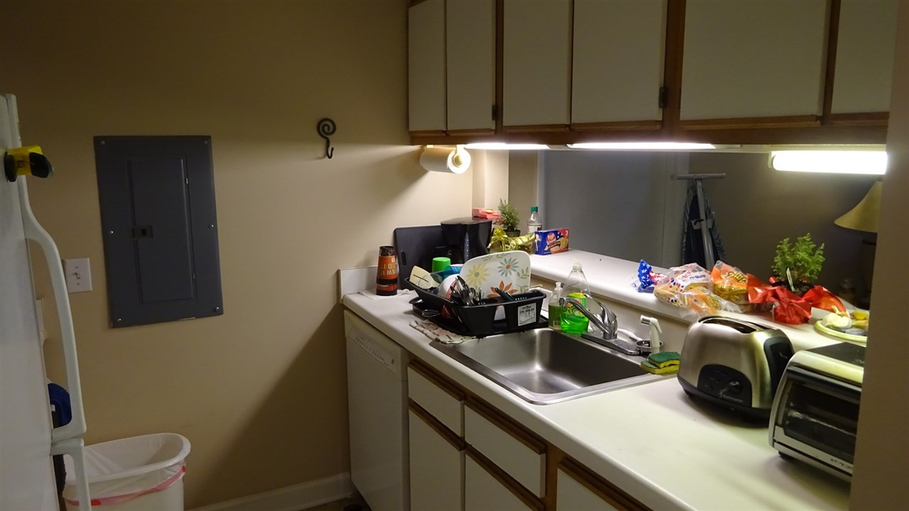 1430 Collegiate Circle, Unit 101 Raleigh, NC 27606 - Photo 9 of 18 Refrigerator, washer and dryer are included with this condo. Kitchen