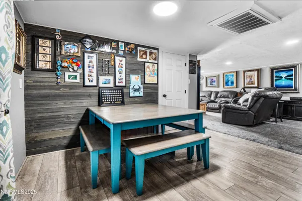 a living room with furniture a table and a large window