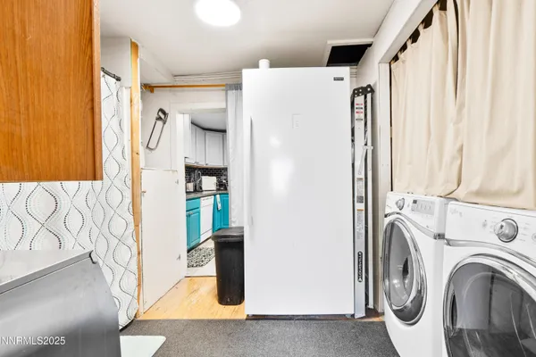 a view of storage and utility room with washer and dryer