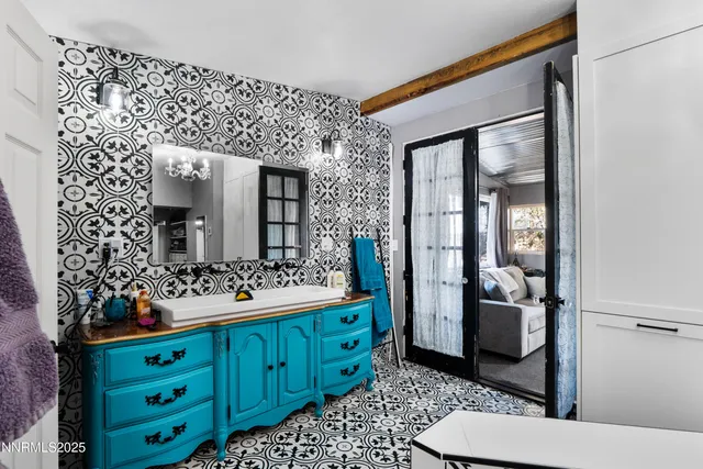 a bathroom with a double vanity sink mirror and toilet