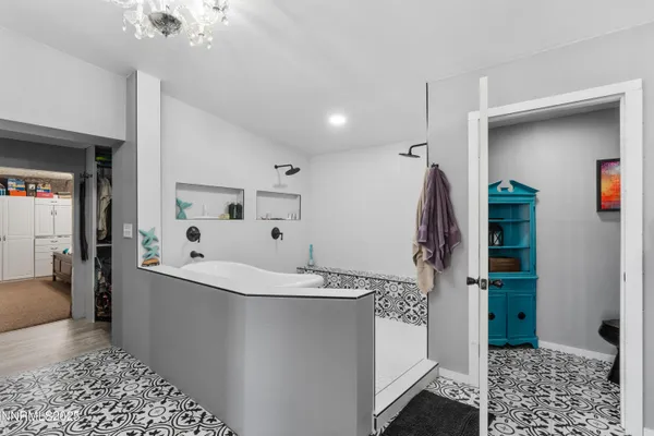 a bathroom with a bathtub and a shower