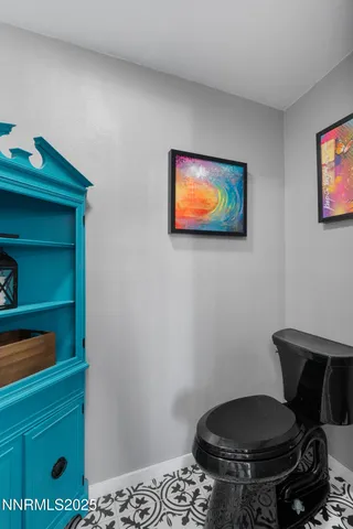 a bedroom with a bed and a chair