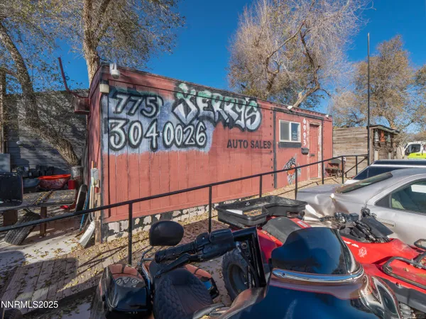 a view of a garage with parked cars