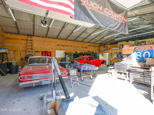 a view of a house with a patio and fire pit