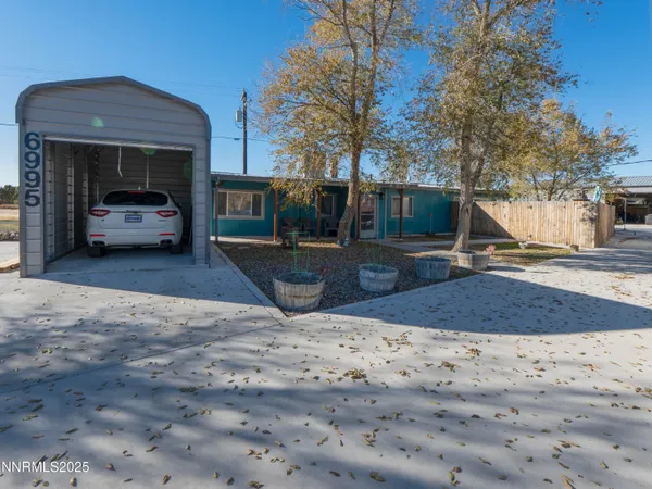 a view of a backyard of the house