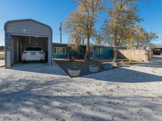 a view of a backyard of the house