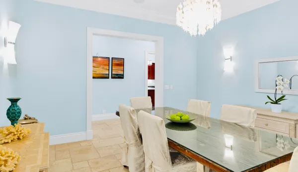 a kitchen with a stove a sink and a window