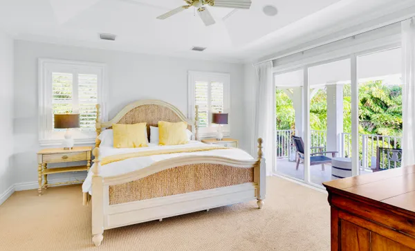 a spacious bathroom with a tub sink shower and mirror