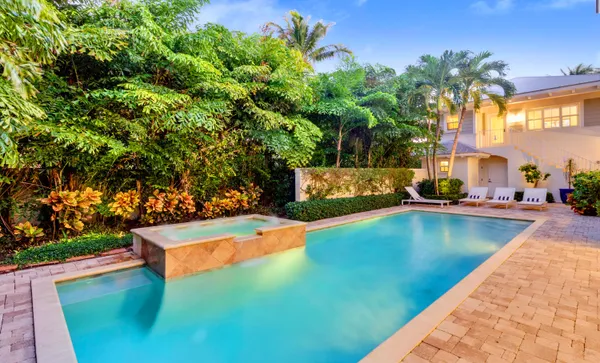 a view of swimming pool with outdoor seating