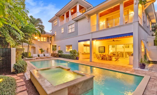 a swimming pool with potted plants