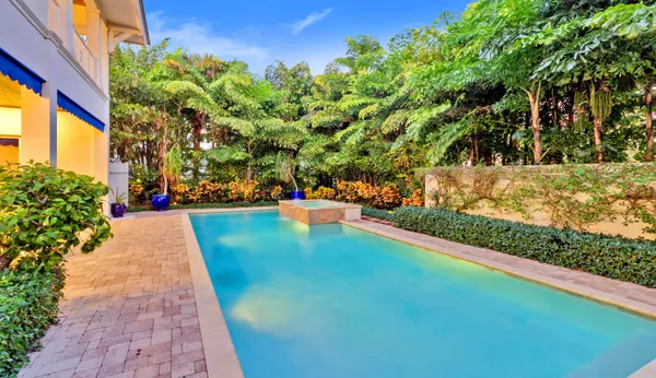 a view of swimming pool with outdoor seating