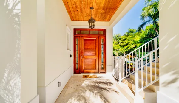 a view of a hallway with dining area