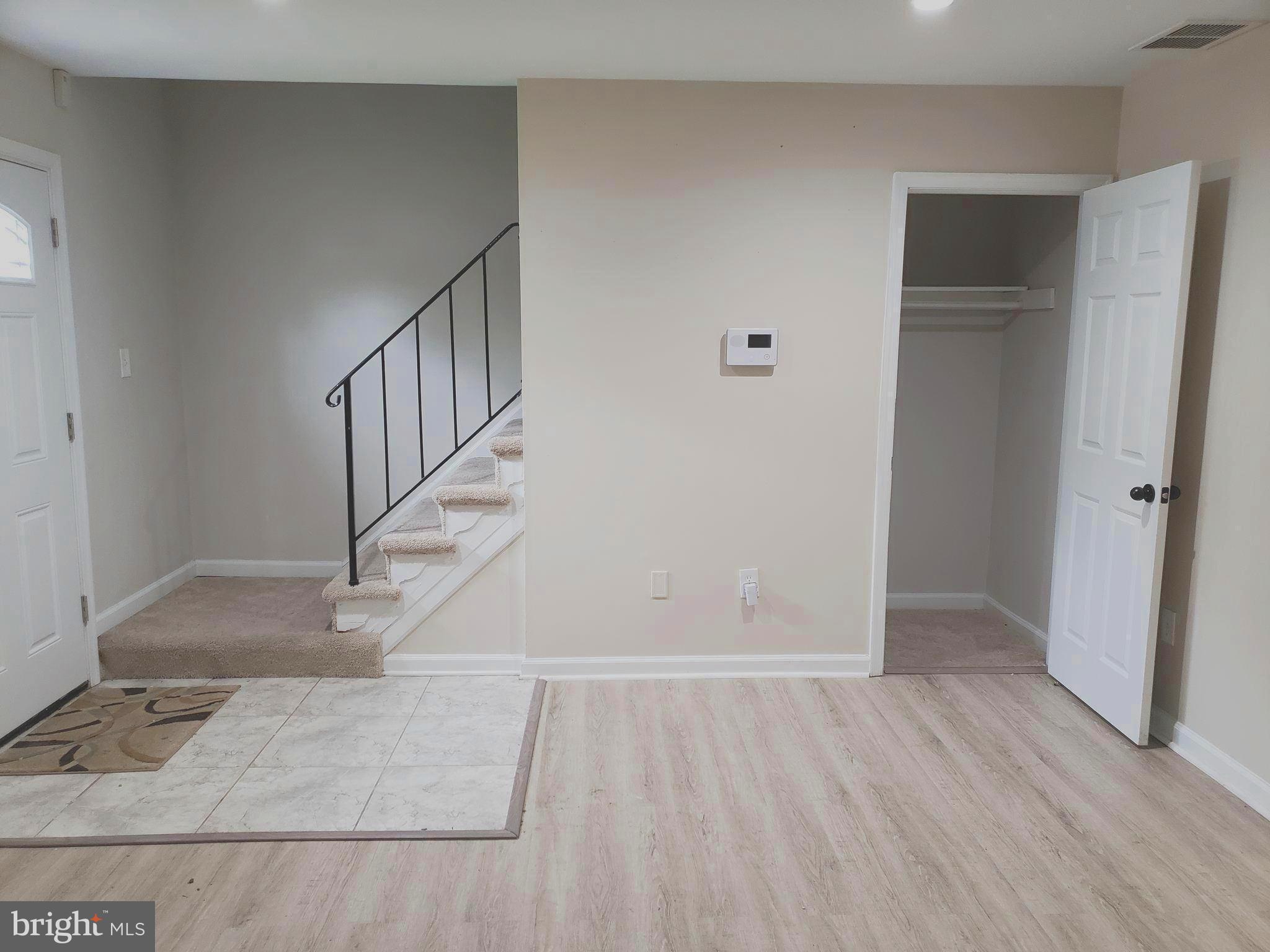 12107 Dove Circle Laurel, MD 20708 - Photo 18 of 62 Main Level Coat Closet & Stairs