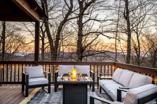 a view of a chairs and table on the deck