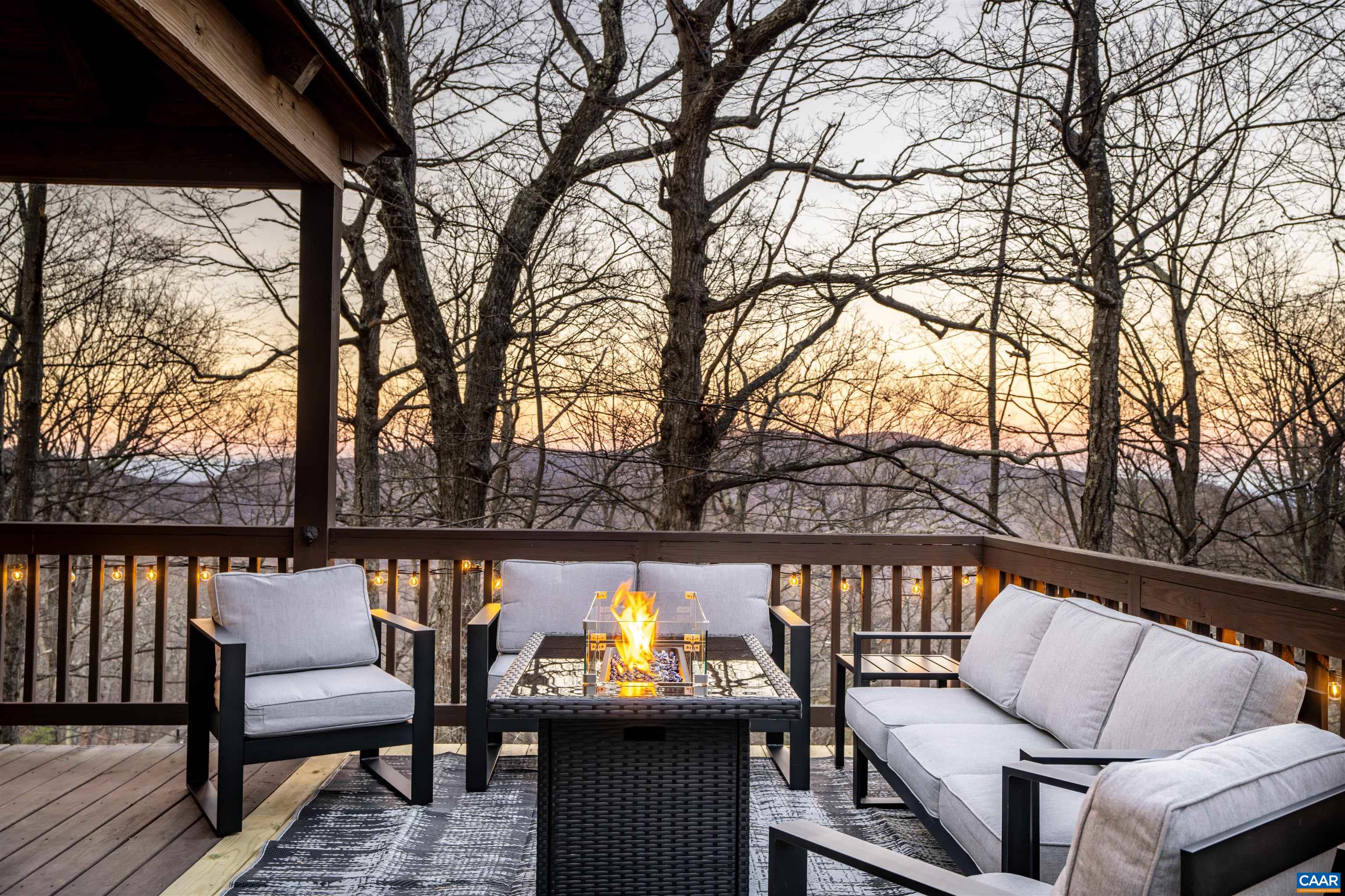 a view of a chairs and table on the deck